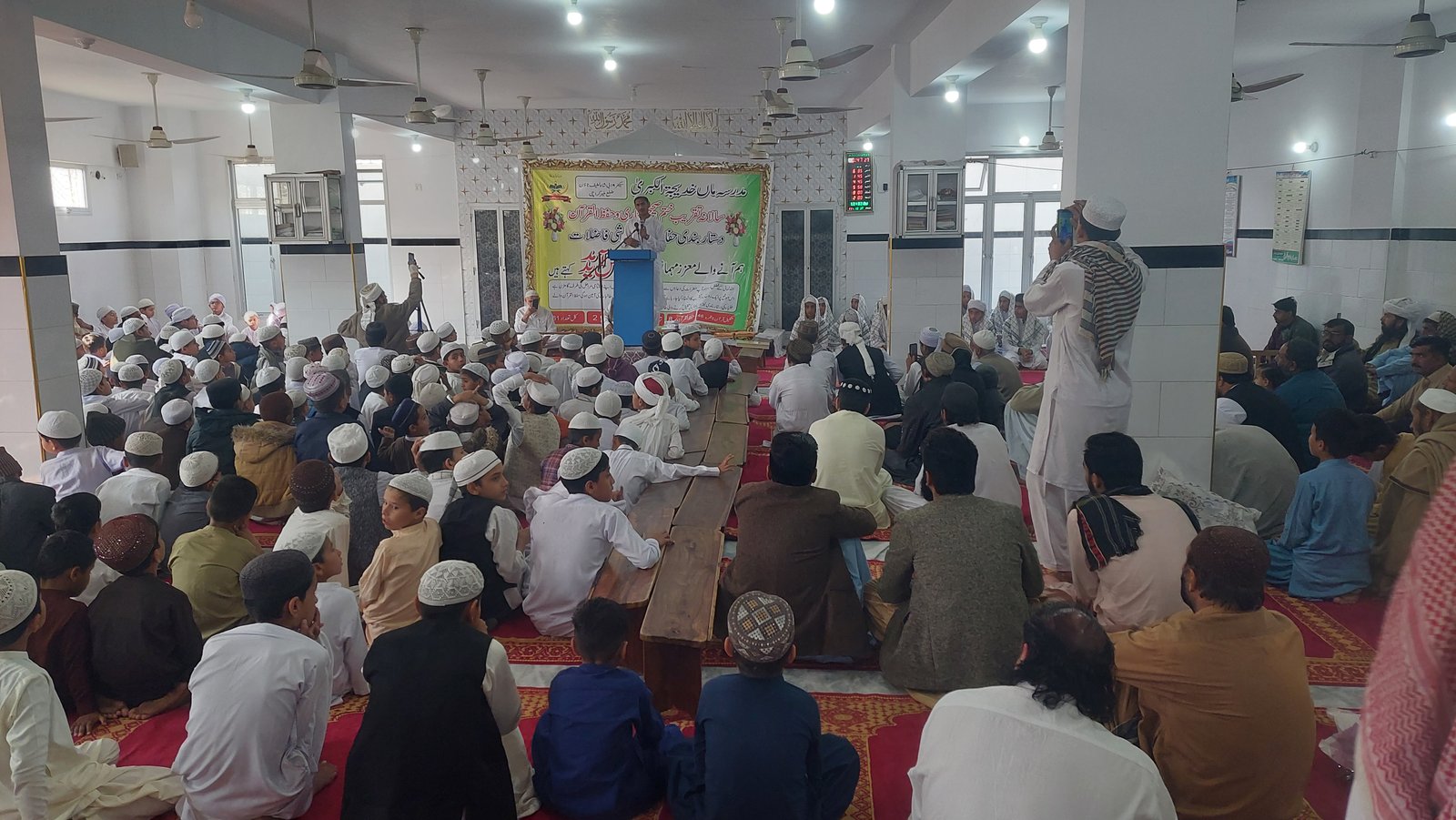 Students and community members seated during the Madrassa annual completion ceremony