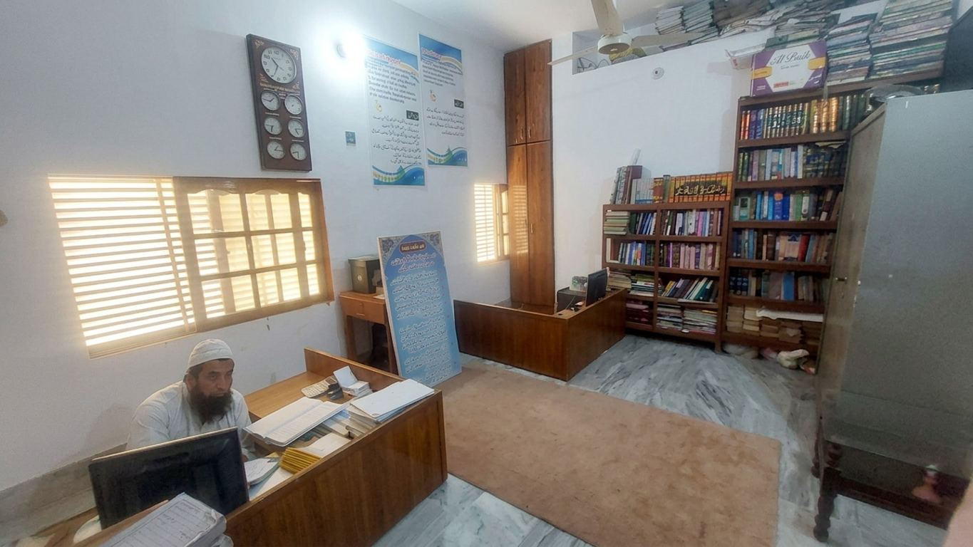 Madrassa library and office with bookshelves and study desks