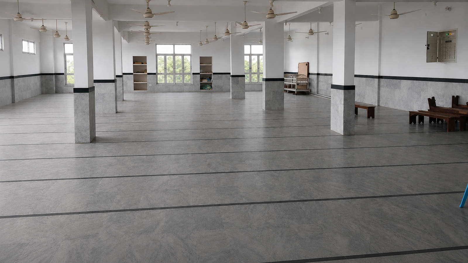 Wide view of the empty main teaching hall at the Madrassa