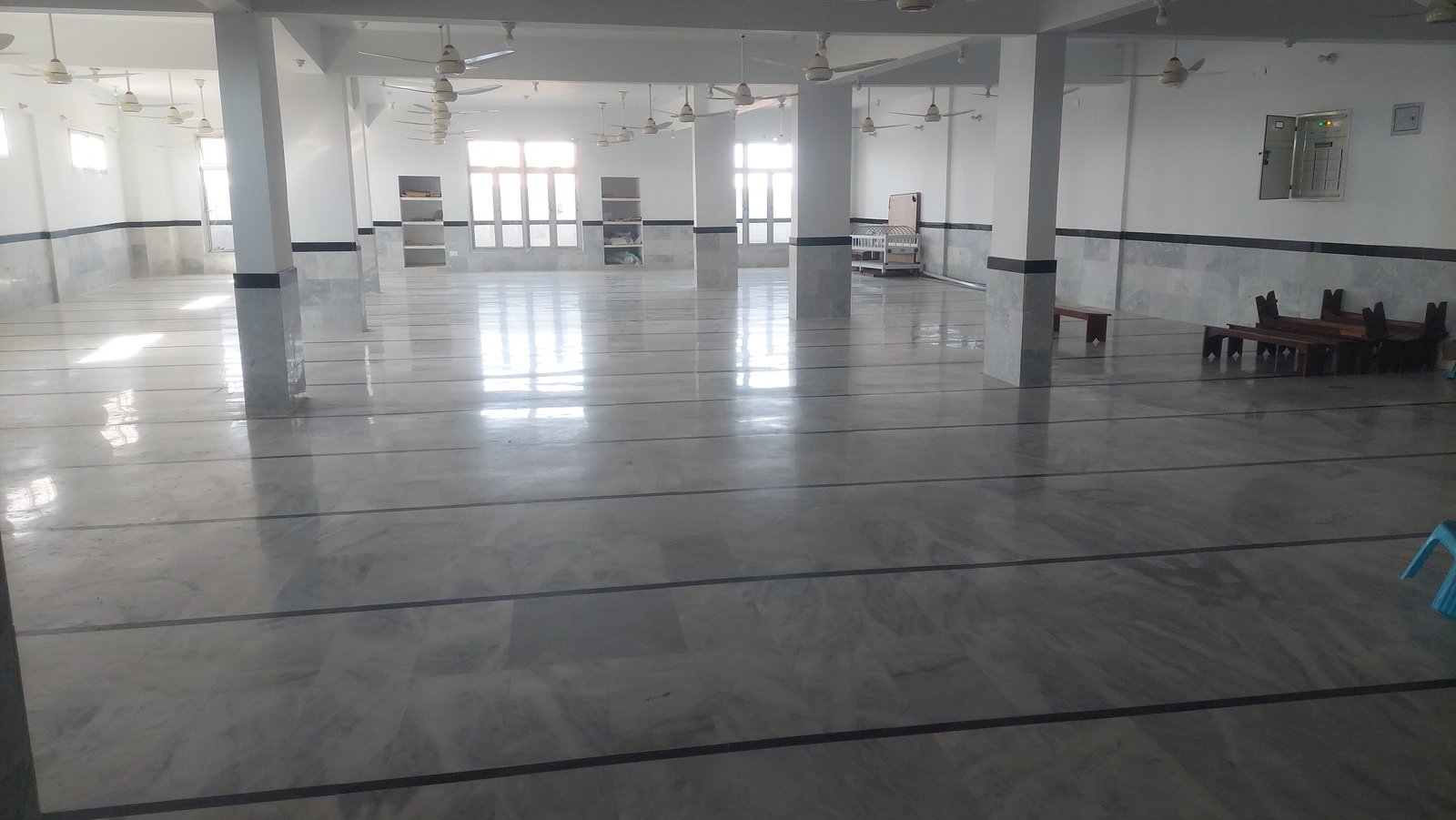 Wide interior view of the Madrassa teaching hall prepared for classes