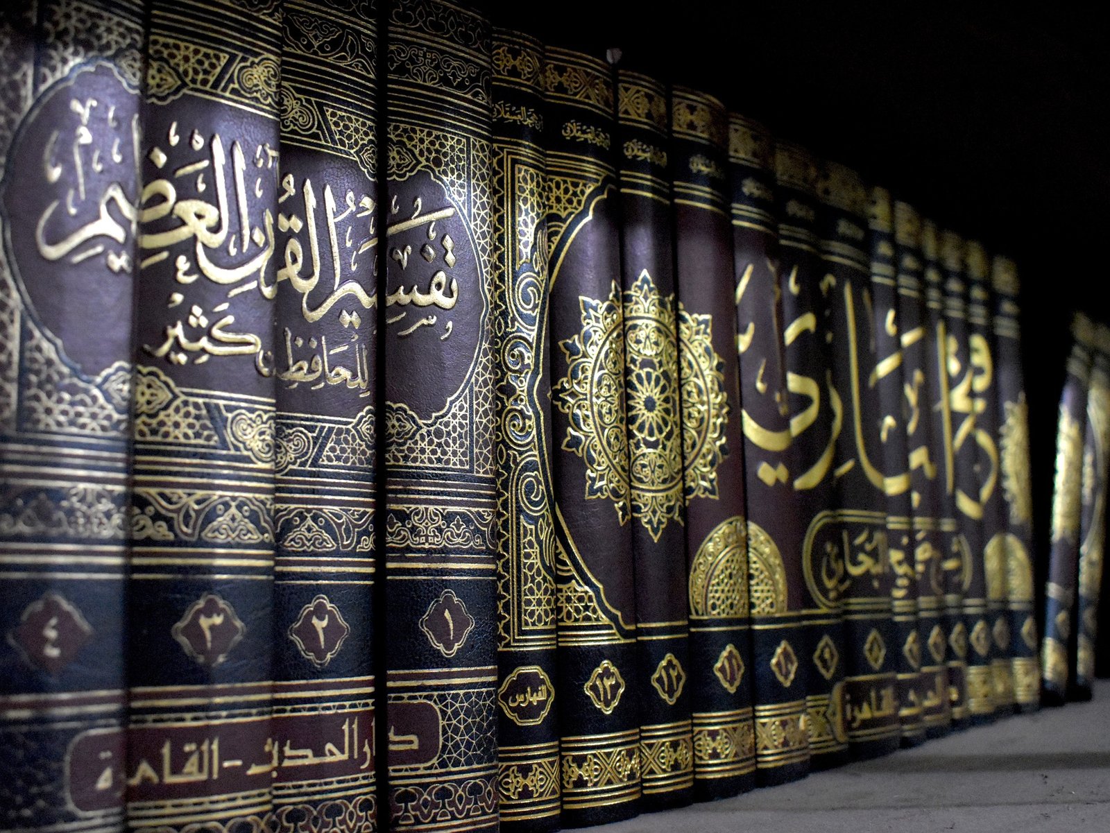 Decorative Arabic book volumes arranged together on a shelf